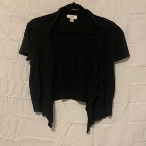 Cropped black cardigan with ruffle edge
